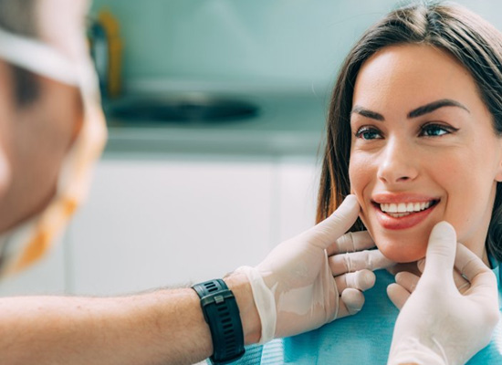 Dentist examining a patient’s teeth